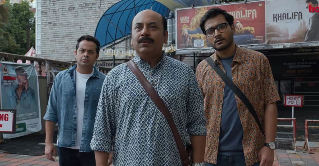 Eken and his sidekicks in front of a theatre in Kerala. Trailer screenshot: YouTube: Hoichoi Studios