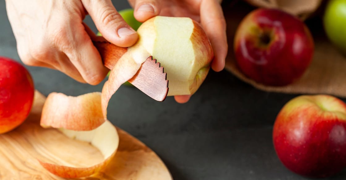 Peeling an apple. Photo: Shutterstock/grandbrothers