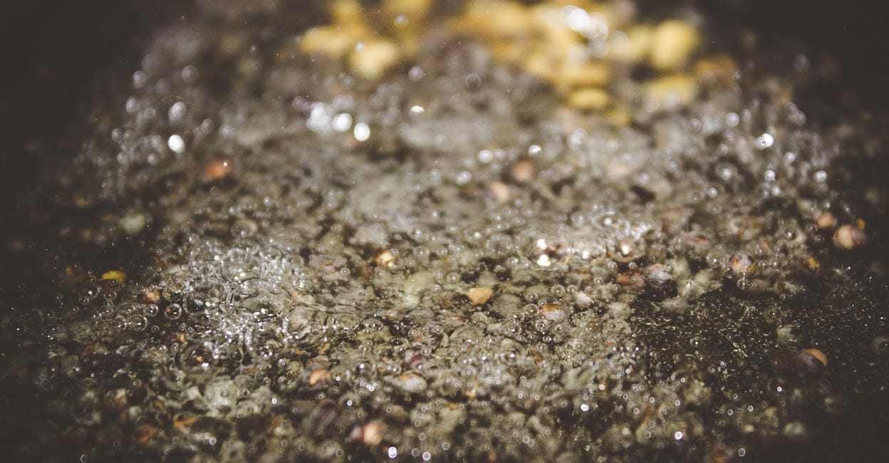 720704077 Mustard seeds popping in hot oil. Photo: Shutterstock/Jeswin_Thomas