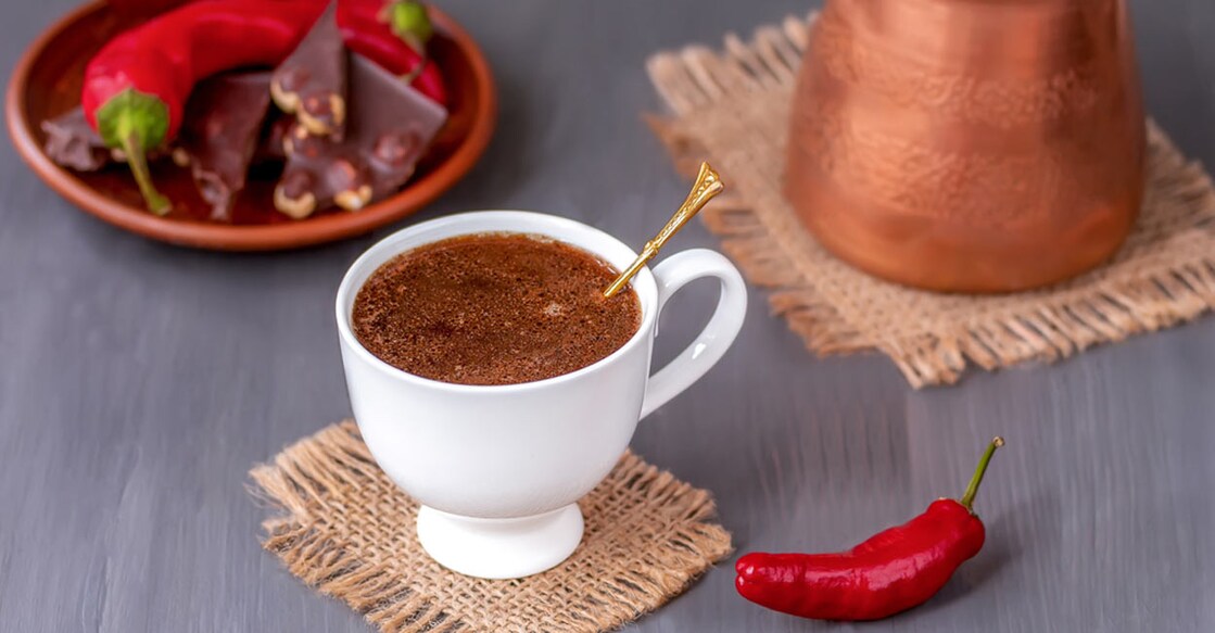 Cup of spicy chili pepper coffee with dark chocolate. Photo: Shutterstock/Dementieva Iryna