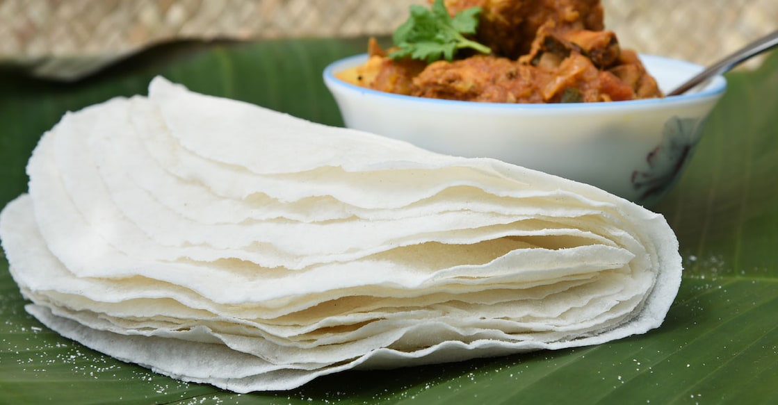 Rice pathiri with chicken curry. Photo: Shutterstock/Santhosh Varghese