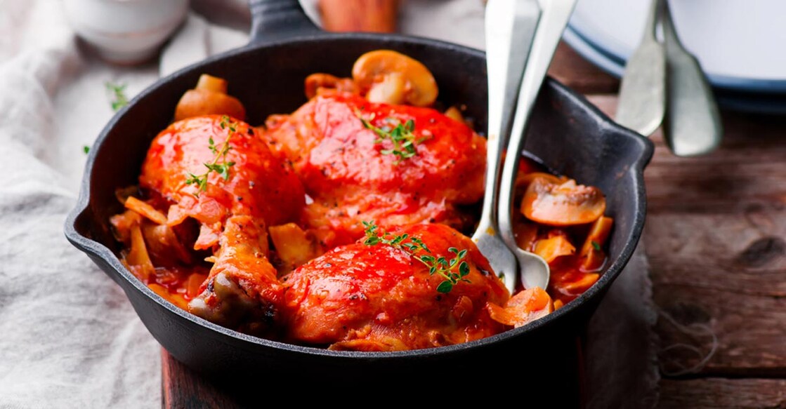 Marengo chicken in a frying pan. Photo: Shutterstock/zoryanchik