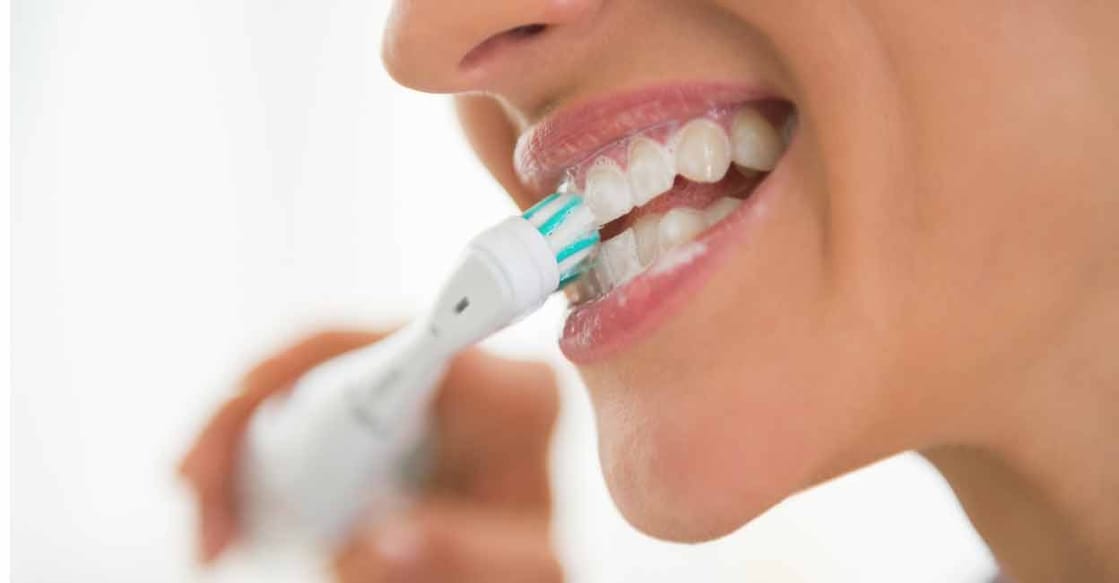 Use a soft brush to avoid gum bleeding. Photo: iStock/CentralITAlliance