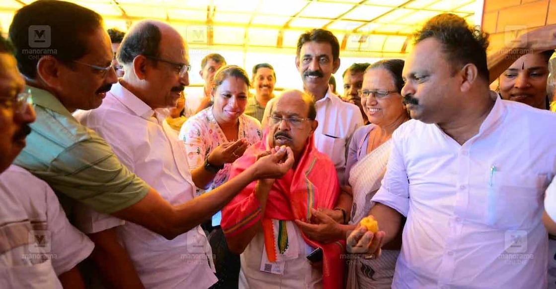Party workers offer sweets to G Sudhakaran for his performance in the Kerala Assembly Elections 2026. Photo: Manorama