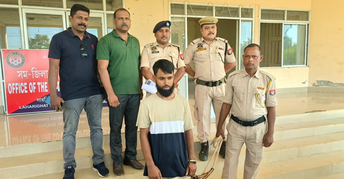 Sub-inspector Manoj (left) and Inspector V Rajkumar, along with the Assam police, after arresting Sirajul Islam. Photo: Special arrangement