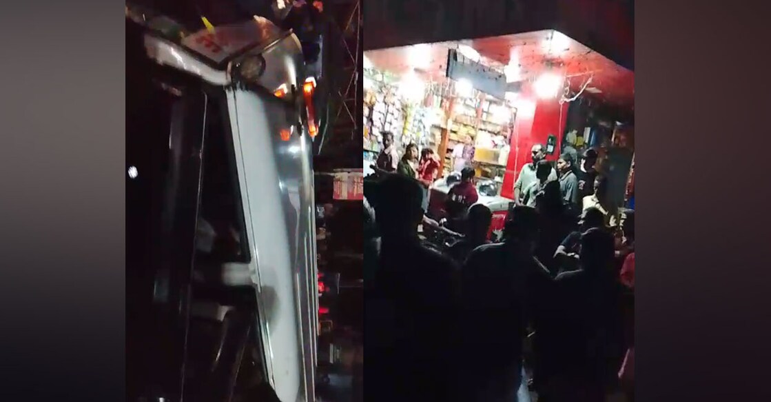 People gather near the accident site to confront the police officer. Photo: Special Arrangement