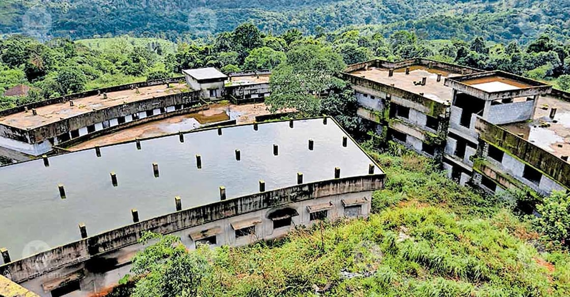 The half-constructed buildings at Makkimala in Thavinjal panchayat, now overtaken by weeds and neglect.