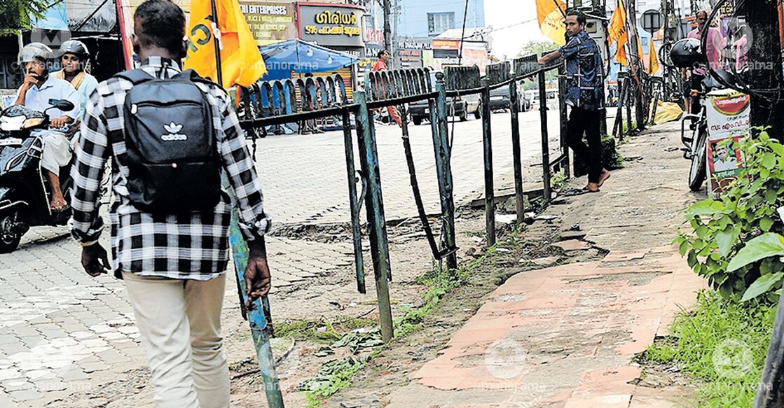The rusted and broken iron rods along the footpath near the Pathanamthitta Mini Civil Station, which pose a serious risk to pedestrians. Photo: Manorama