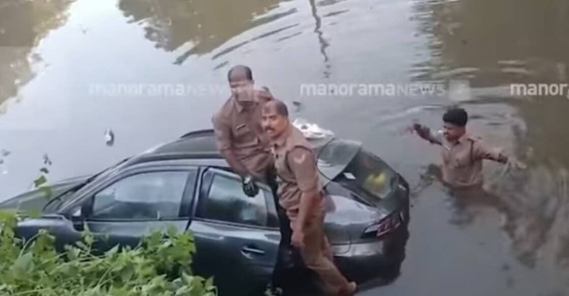 The car drove by Dr Amal plunged into a canal at Thottukadavu in Vaikkom. Photo: Screengrab/Manorama News