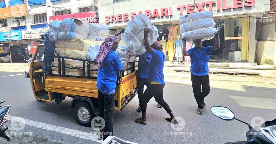 Headload workers at the Ernakulam market. Photo: Anantha Narayanan K/ Manorama. 