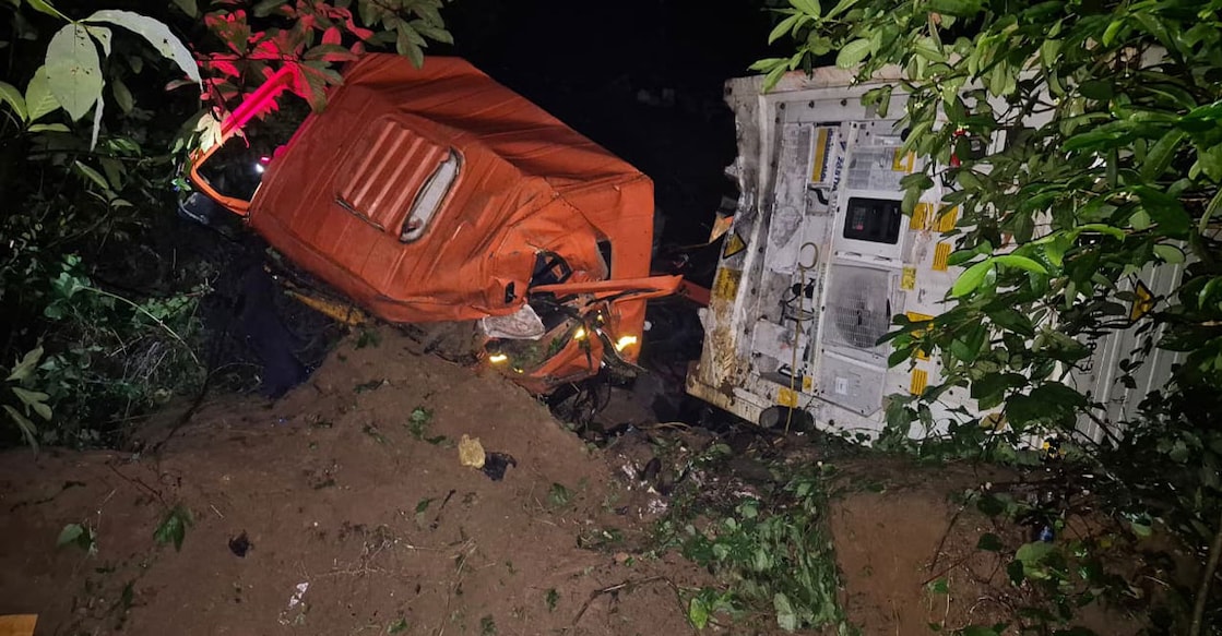 The container lorry that lost control and overturned into a gorge at Nellappara on the Thodupuzha–Ponkunnam state highway. Photo: Special arrangement