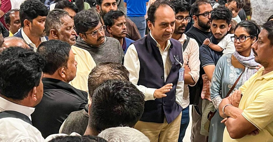 Acting High Commissioner of India to Srilanka Satyanjal Pandey meets stranded Indian passengers at Bandaranaike International Airport, in the wake of Cyclone Ditwah in Sri Lanka. Photo: PTI via X/@IndiainSL