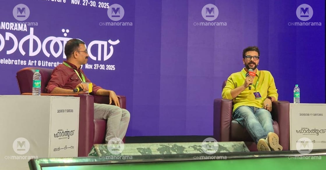 Ramesh Pisharody with Manorama News journalist Jayamohan at Hortus 2.0. Photo: Manorama.