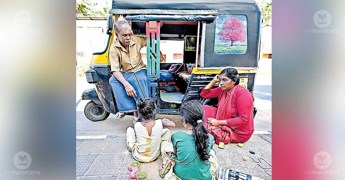 V Anilkumar and Ramya, sick and homeless, with their two young daughters who were living in an autorickshaw after losing their home. Photo: Special arrrangement