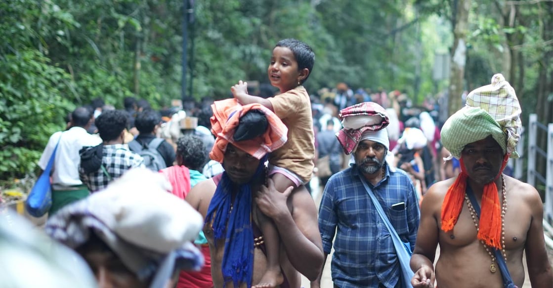 Ayyappa devotees trekking to the hill shrine. Photo: IPRD.