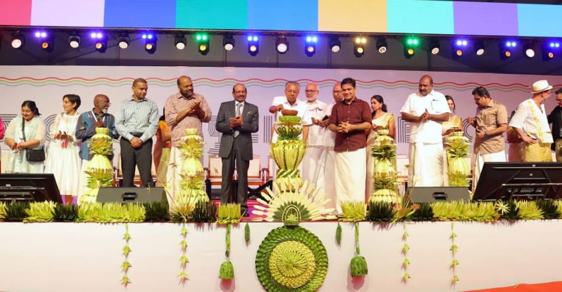 Lighting a specially crafted kuruthola lamp made from tender coconut leaves, the Chief Minister formally opened the Biennale. Photo: Special Arrangement. 