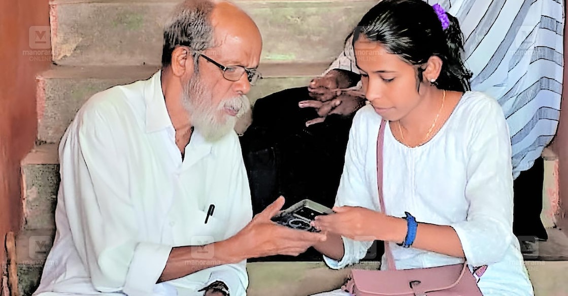 Aswathi, who won from the Thrikkannapuram ward, stands alongside her father, Purushothaman, at the vote-counting centre in Nilamel NSS College. Photo: Manorama