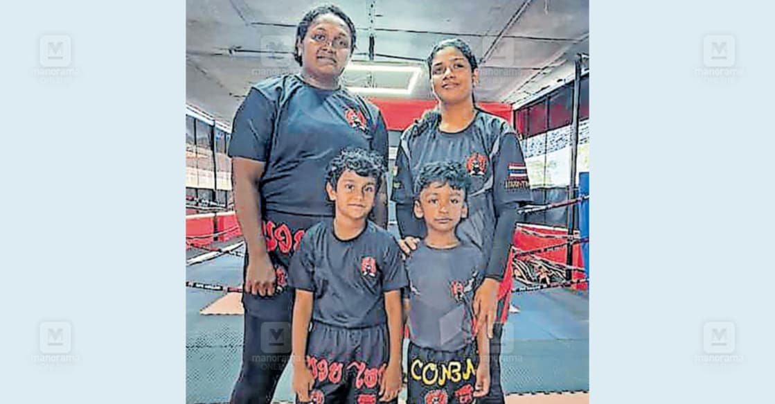 S Devika and Asha Rinto, national boxing champions, stand with their children, Riyana and Meenakshi, who inspired them to step into the ring. Photo: Manorama