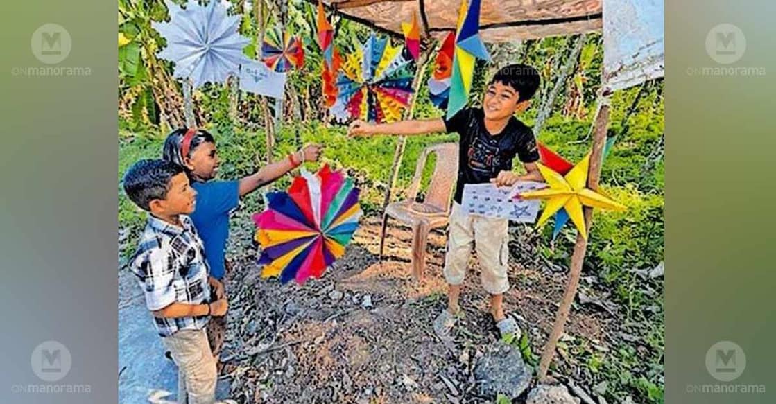 Young Manikandan presents a Christmas star from his shop to one of his friends. Photo: Special arrangement
