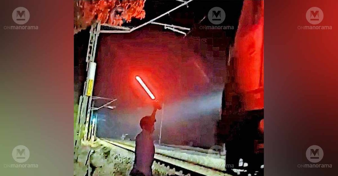 The students flashing a red light to stop a train as part of shooting reels. Photo: Special arrangement