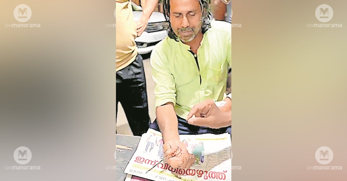 Fire and Rescue personnel from Piravom remove a fishing hook from the palm of Rijo Mathew. Photo: Manorama