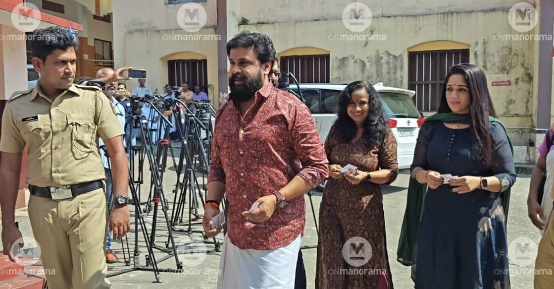 Dileep and Kavya Madhavan arrive at a polling station to cast their votes in the 2025 local body polls. Photo: Onmanorama