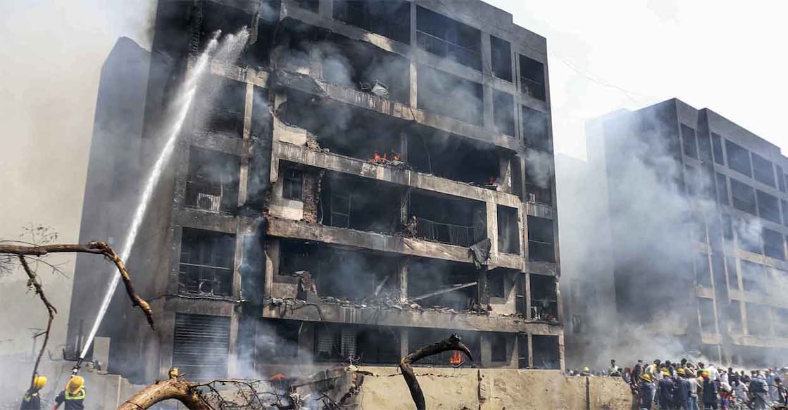 ahd-accident-building Firefighting team at the spot after an Air India plane crashed moments after taking off from the Ahmedabad airport on June 12, 2025. Photo: PTI