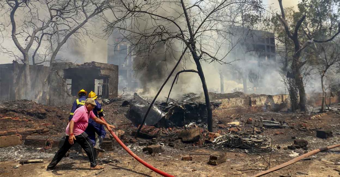 ahd-crash-fire-fighters Firefighting team tries to douse the fire after the London-bound Air India plane crashed moments after taking off from the Ahmedabad airport on June 12, 2025. Photo: PTI
