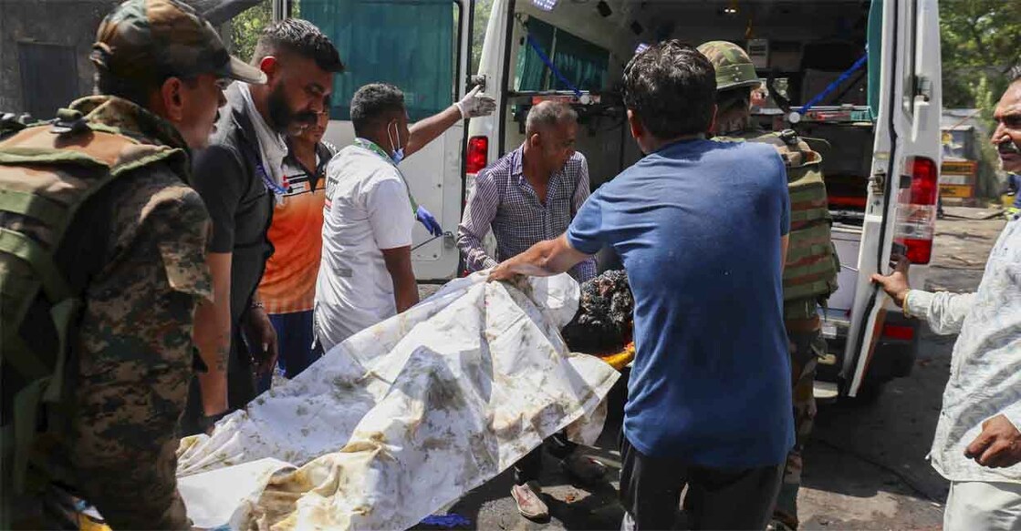 An injured person being removed from the site of the aircraft crash in Ahmedabad on June 12, 2025. Photo: PTI