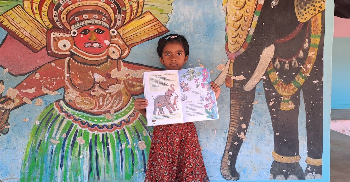 may-sithara May Sithara with her story in the textbook. Photo: Special arrangement.
