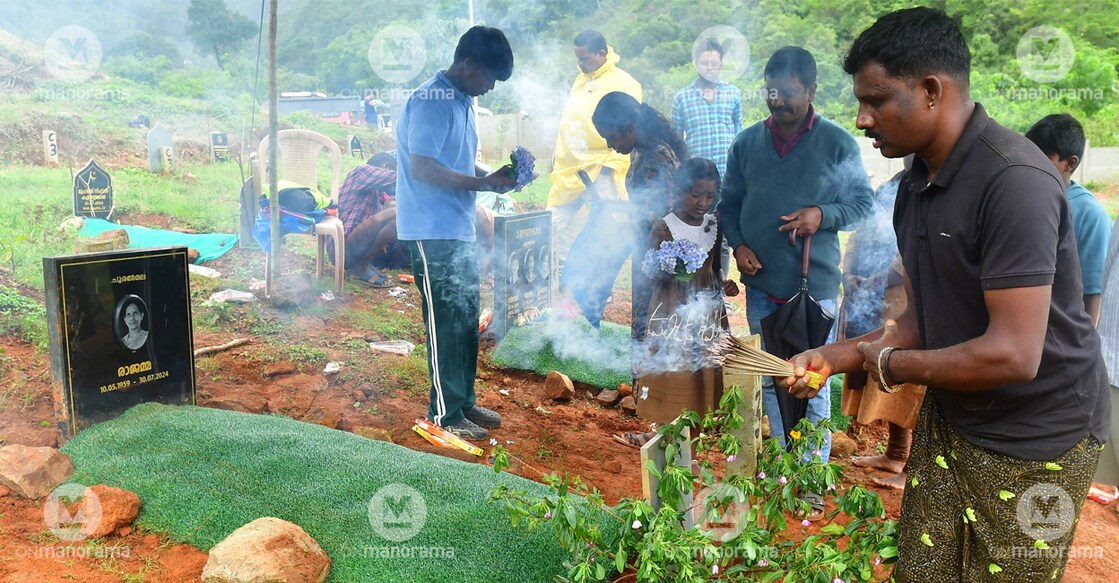 Rajamma's son Anilkumar and other relatives pay homage to the departed soul during the reburial held at the mass grave at Puthumala on Friday. Photo: Dhanesh Ashokan/Malayala Manorama