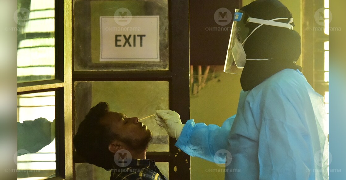 A medical staff member taking a swab sample from a person for testing. Photo: Sameer A Hameed/Manorama