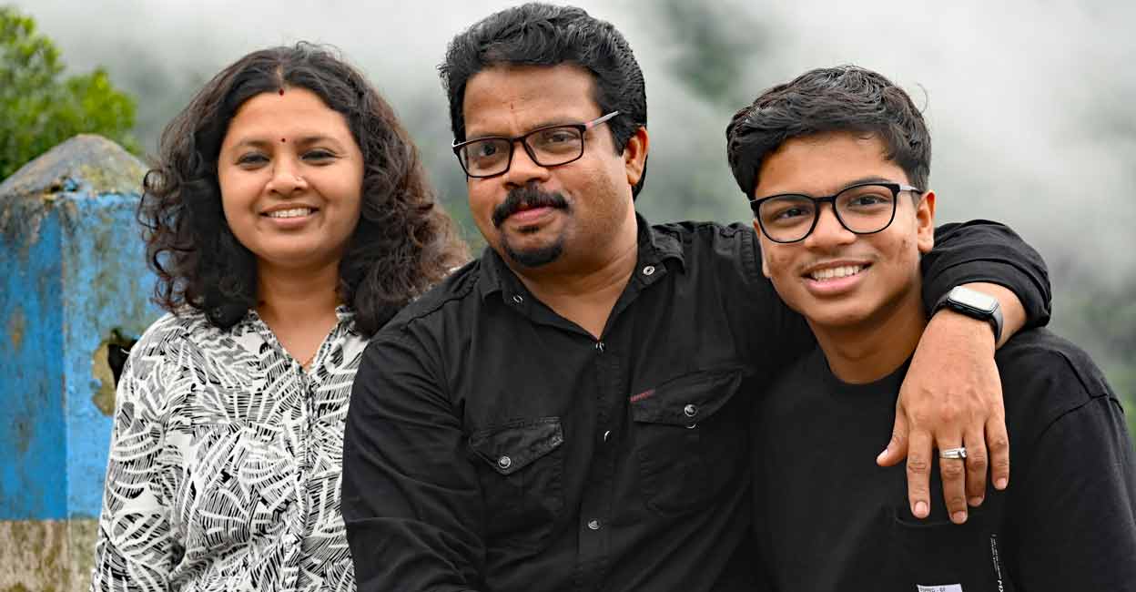 Hridin S. Biju (R), along with his father V Biju (C) and mother G S Shweta. Photo: Special arrangement
