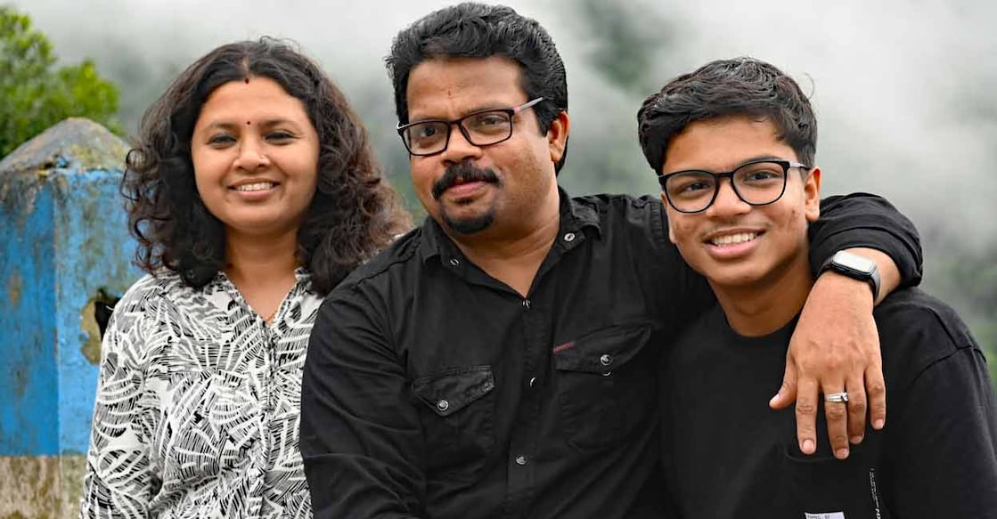 Hridin Hridin S. Biju (R), along with his father V Biju (C) and mother G S Shweta. Photo: Special arrangement