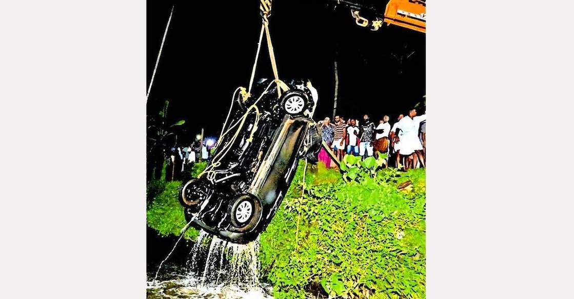 accident-car The car that plunged into a pond near Pallikkathodu being retrieved with the help of a crane. Photo: Special arrangement.