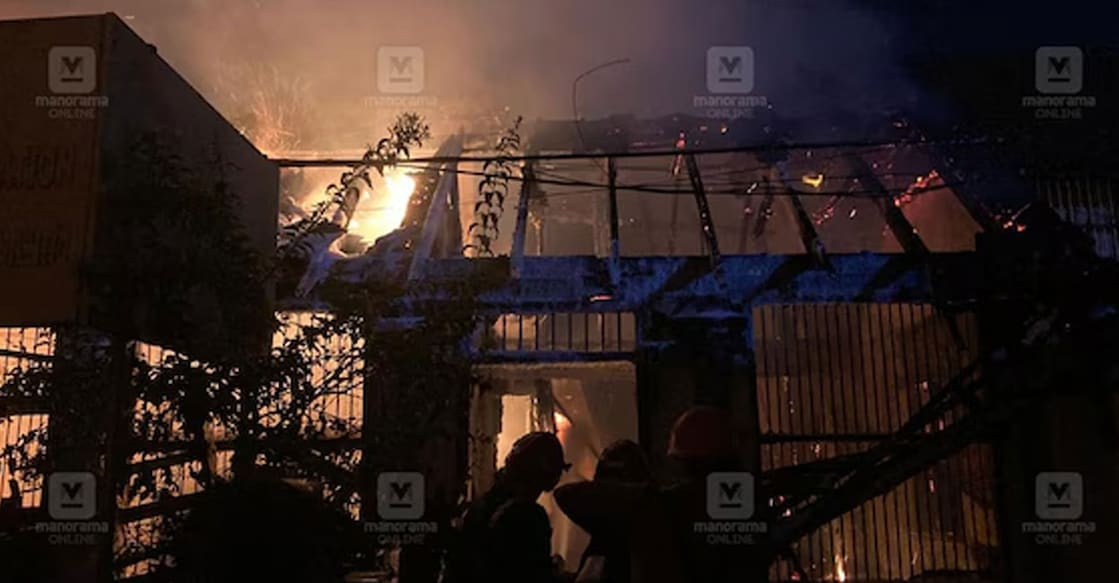agraharam-fire Fire and Rescue personnel attempt to diffuse the flames. Photo: Manorama Online