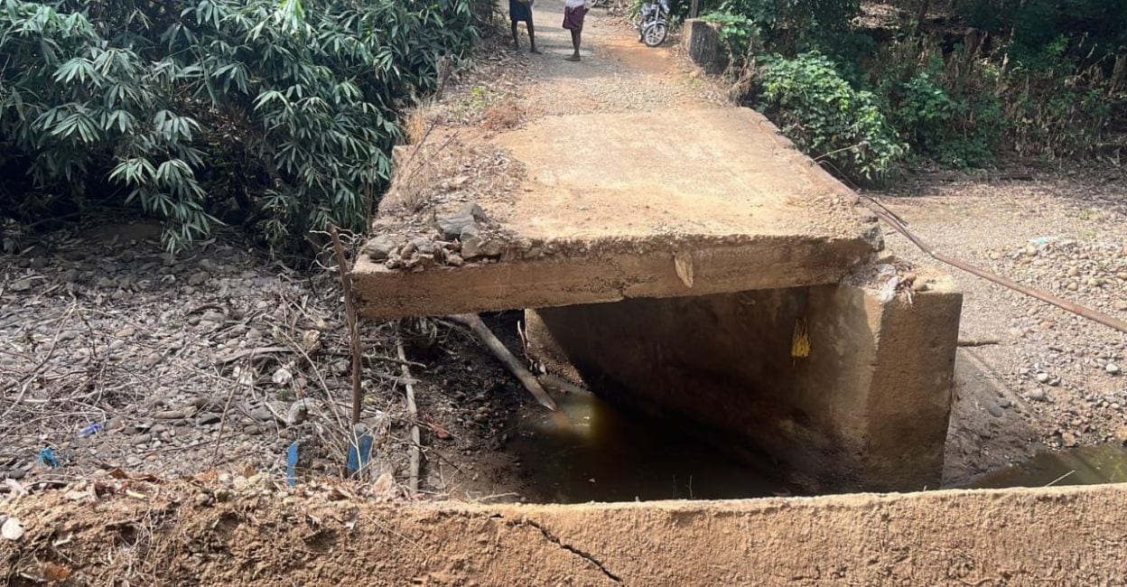 Old collapsed bridge in Kadapuzha The original bridge with the central slabs collapsed. Photo: Special Arrangement.