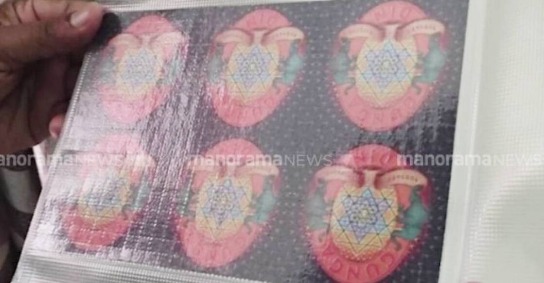 A total of 1,127 LSD blots, 131.66 grams of Ketamine, a hardware wallet holding about ₹ 70 lakh worth of USDT (cryptocurrency) was also seized as part of the operation. Photo: Manorama News