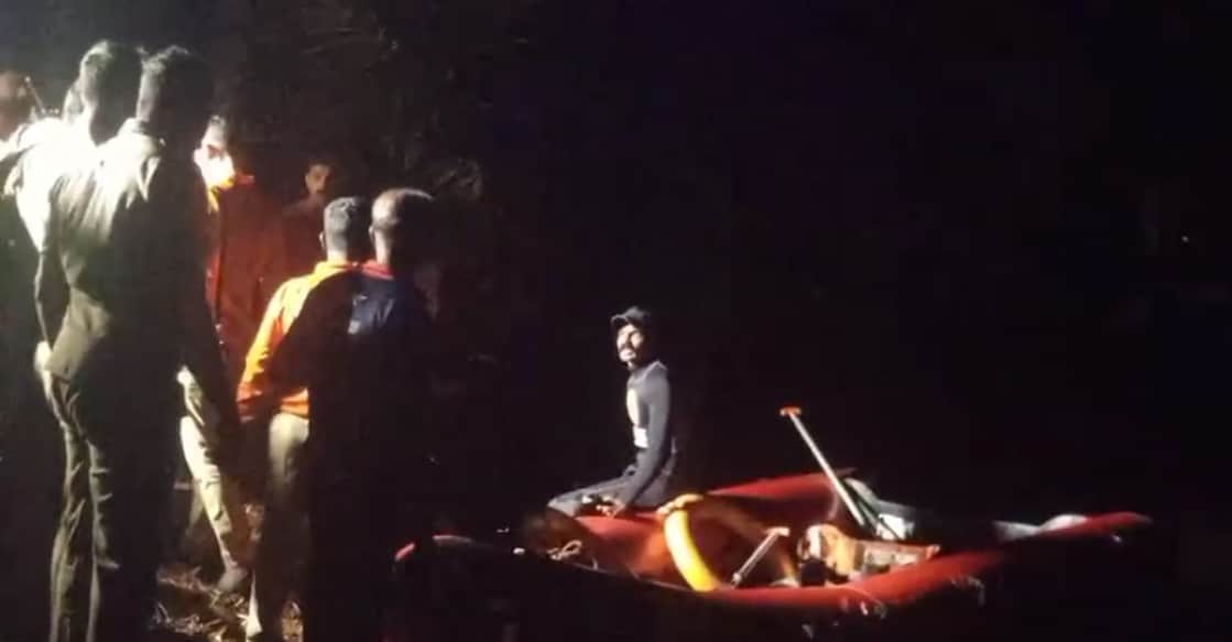 A screengrab shows the fire force and local residents involved in the rescue operation. Photo: Special arrangement