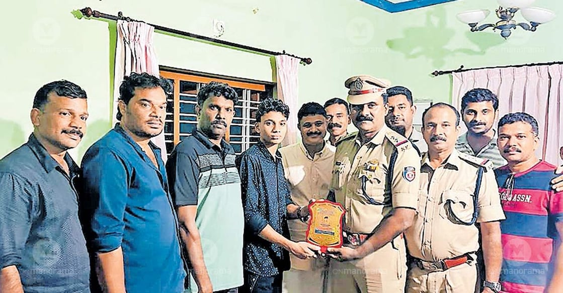 Muhammad Shamil Fire and Rescue personnel and Civil Defence Team members felicitate Vellila Chalakkathody Muhammad Shamil for his life-saving act. Photo: Special arrangement