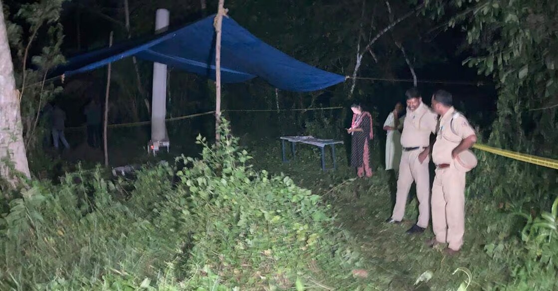 Police at the site where human remains were found in Pallippuram, Cherthala, on July 28, 2025. Photo: Manorama