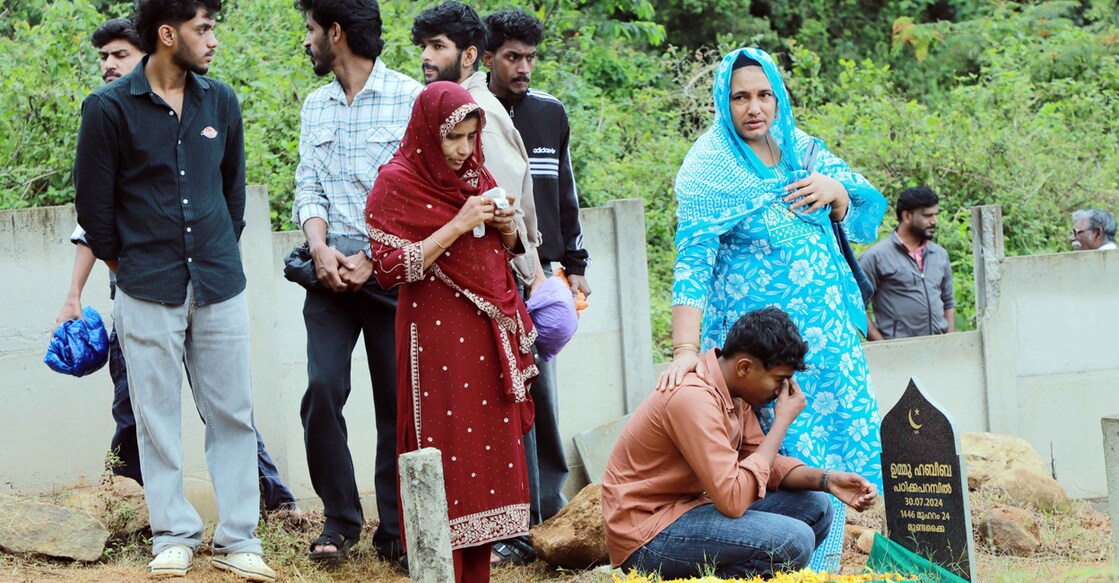 Kith and kin paying homage at the tomb of relatives at Heartland, Puthumala, on Wednesday. Photo: Special Arrangement