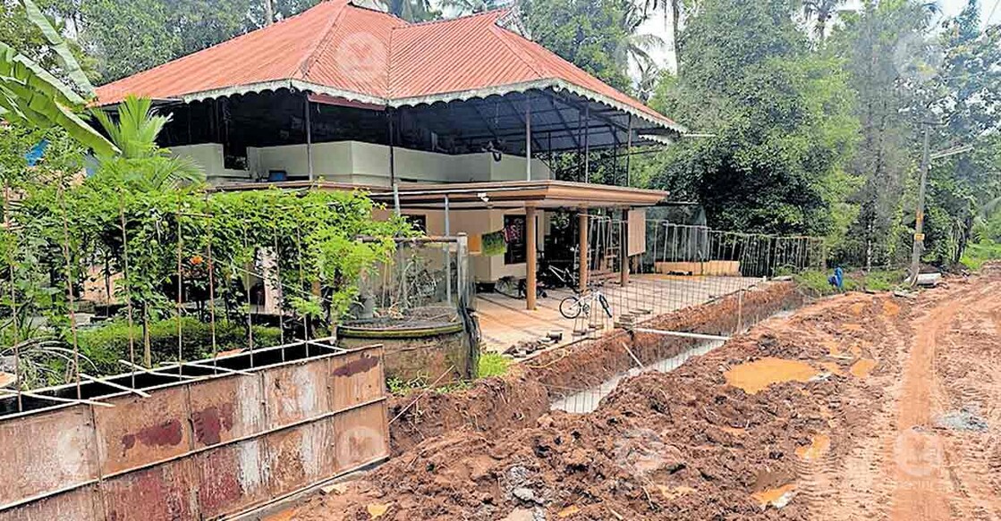 Road construction underway by blocking access to the house of Chalampadam resident Susamma Thomas, who had donated 10 cents for the road widening project. Photo: Special arrangement