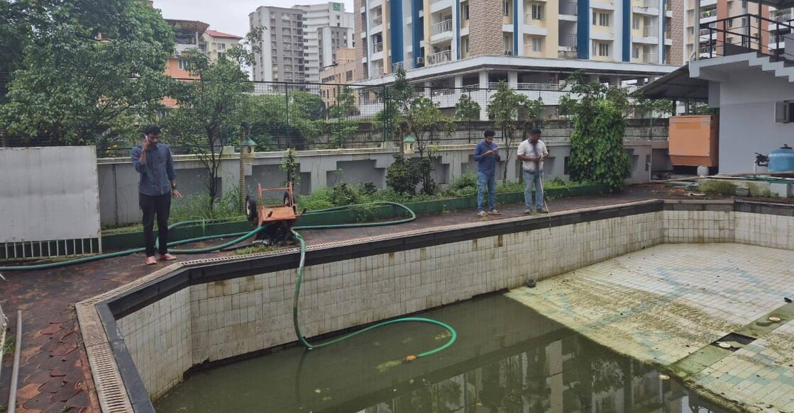 Water being drained from a pool to clear the area for STP at an apartment in Kochi. Photo: Special arrangement. 