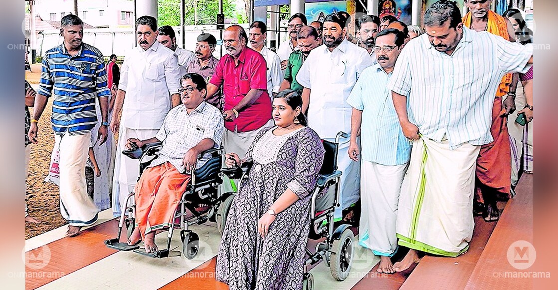 Minister V N Vasavan inaugurates the new ramp, welcoming devotees in wheelchairs to the Ettumanoor Mahadeva Temple. Photo: Manorama
