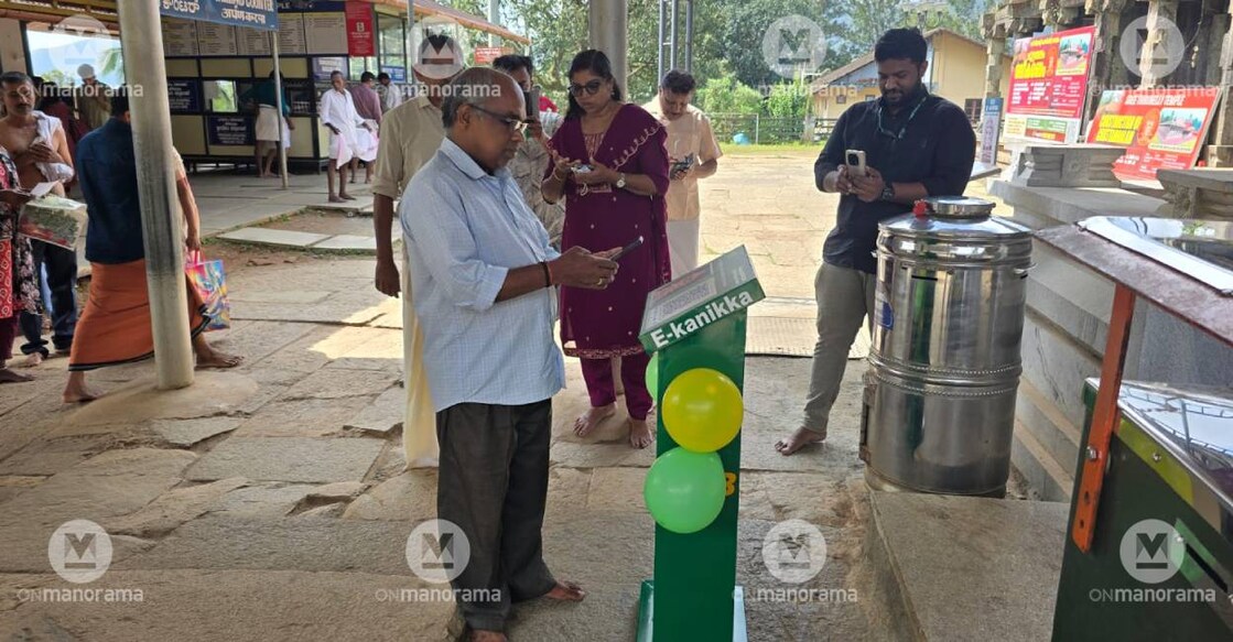 A man makes digital offering at Thirunelli Sree Maha Vishnu temple. Photo: Special Arrangement