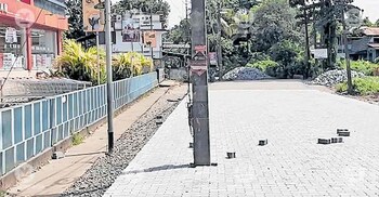 What for? Road renovation goes in vain as electric pole still stands in the middle