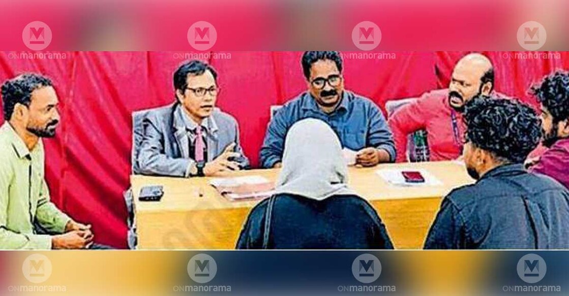 Judge K Sanil Kumar (2R) leads District Legal Services Authority's National Lok Adalat. Photo: Special arrangement