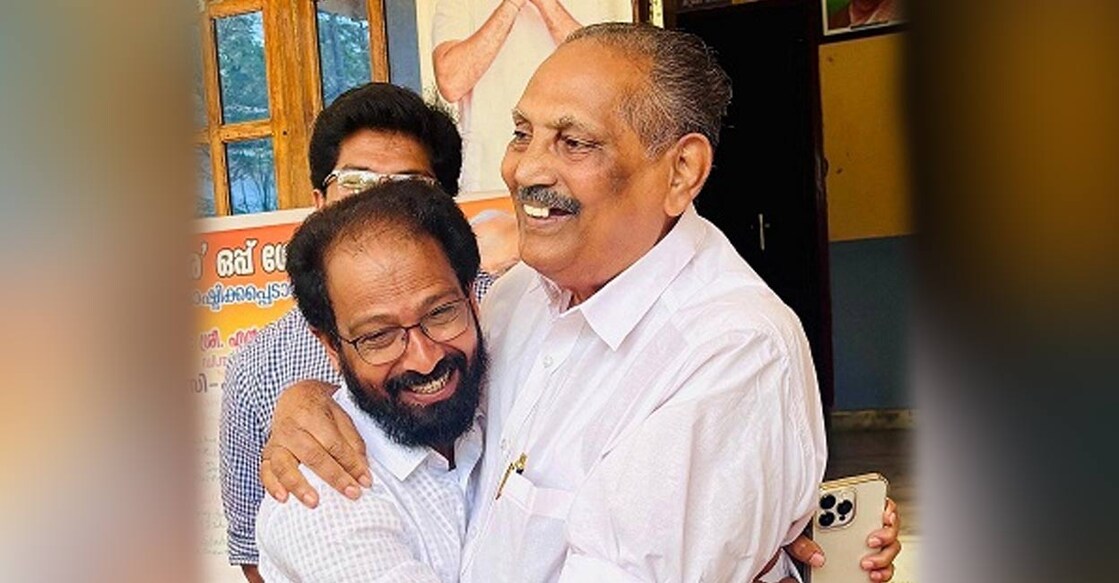 Appachan (R), while handing over charge, embraced Isaac (L) and described him as 'like a son.' Photo: Special arrangement. 