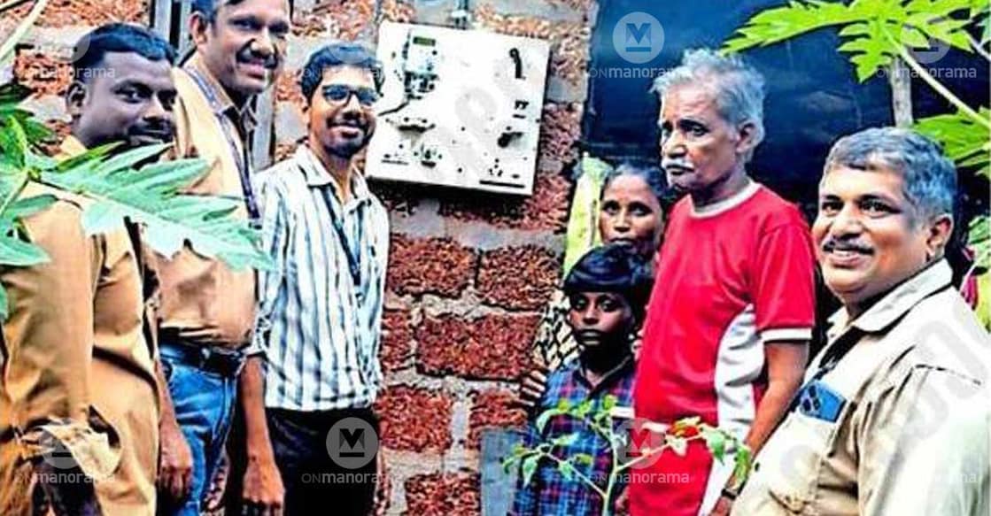 Sandeep Sudheer (3L), Assistant Engineer of the KSEB Periya Section Office, performs the switch-on ceremony at the house of Jayanthi, a resident of Periya Marankavu, after the electricity connection was provided under the supervision of KSEB Periya Section Office employees. Photo: Special arrangement